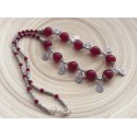 Collier de perles rondes rouges avec spirales