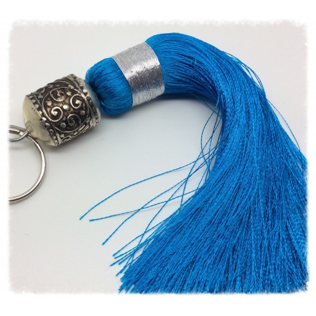 Grand pompon en soie turquoise